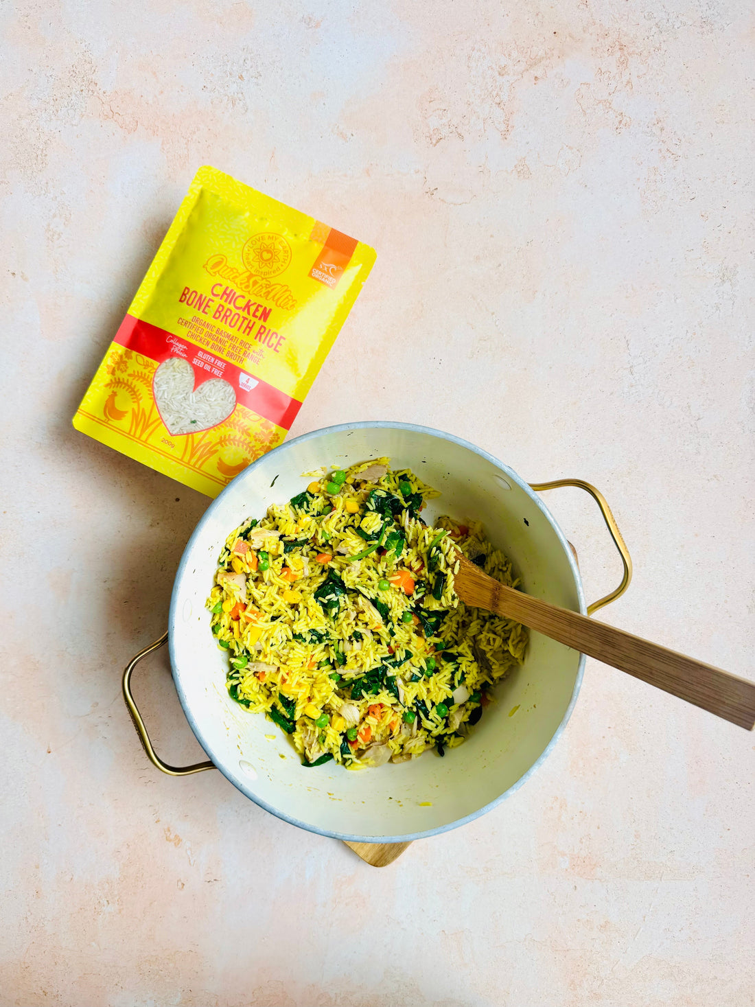 Bowl of Organic Chicken Bone Broth Rice with grilled chicken, mixed vegetables, and fresh coriander garnish
