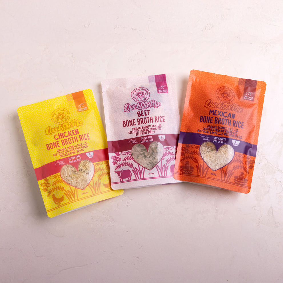 Three packages of Love My Earth bone broth rice on a light background