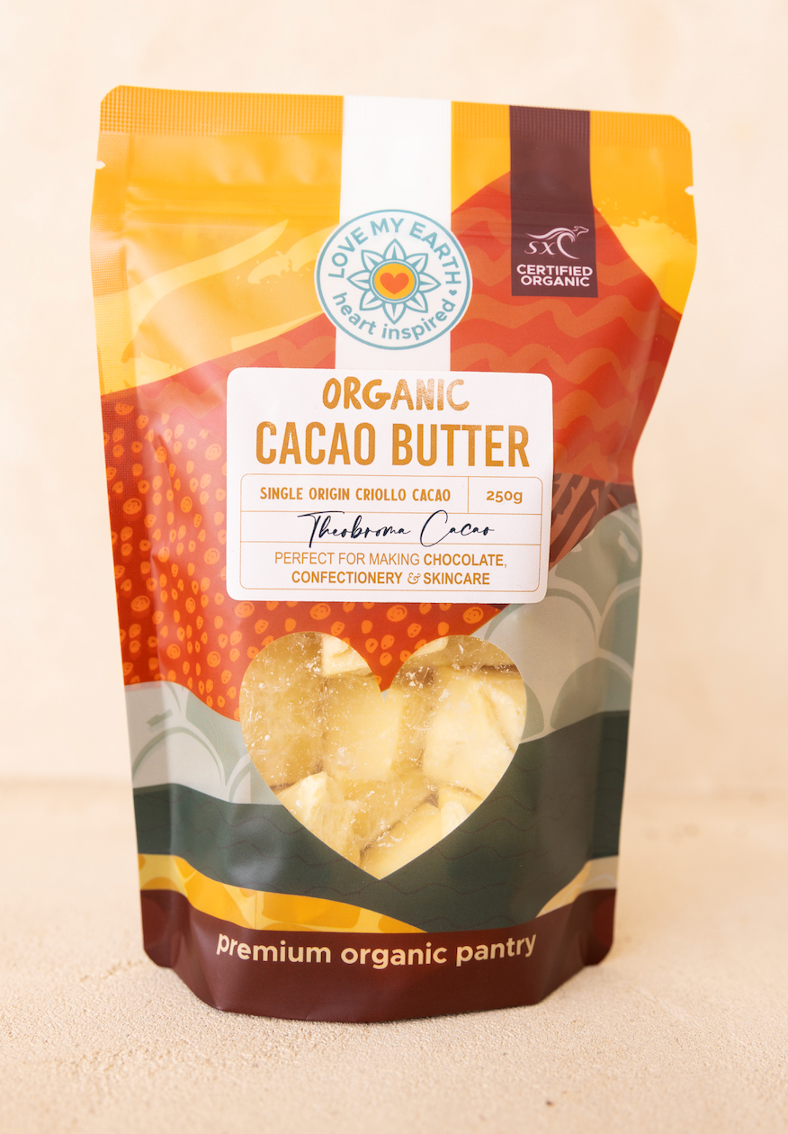 Bag of organic cacao butter with a visible brand logo on a beige background